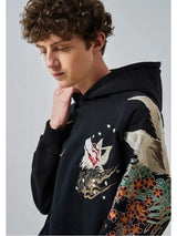 KAPUZENPULLI MIT NEUN SCHWÄNZEN UND STICKEREI