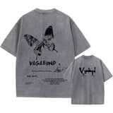 Gray t-shirt with black graphic design and 'Vagabond' text on a white background