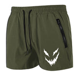 Green shorts with a white graphic design on a white background