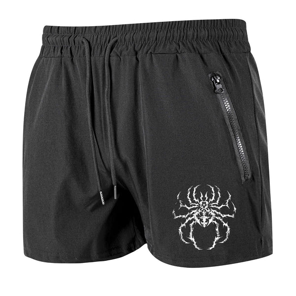 Black shorts with a spider design on a white background