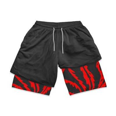 Black shorts with red and black patterned cuffs on a white background